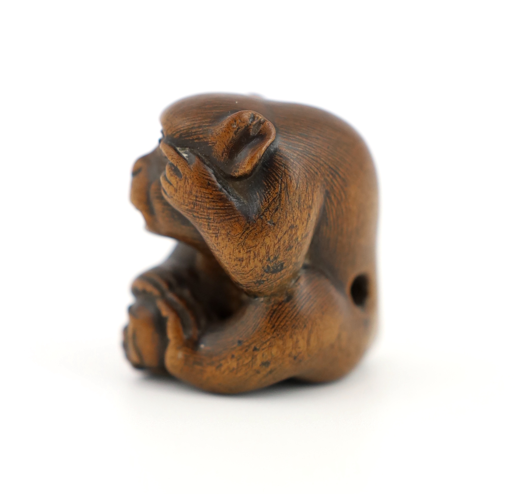 A Japanese carved wood netsuke of an ape, Tamba School, 19th century